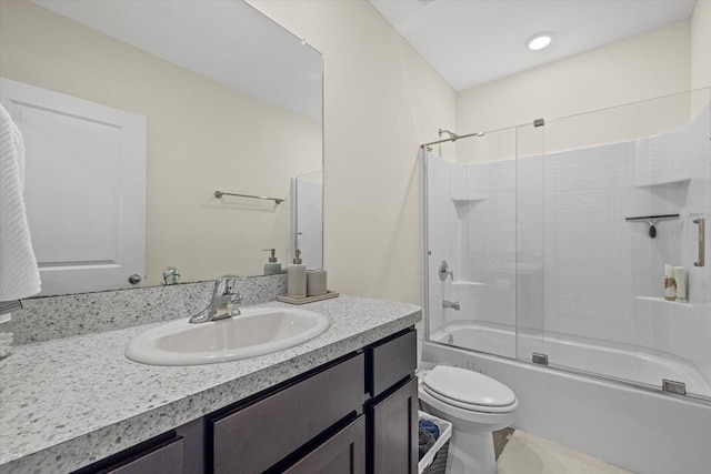 full bathroom with vanity, shower / bath combination with glass door, and toilet