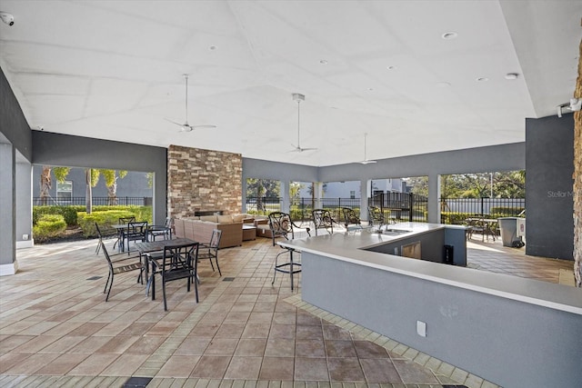 view of patio / terrace with ceiling fan, an outdoor hangout area, and a wet bar