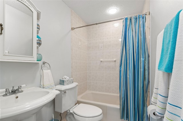 full bathroom featuring toilet, sink, a textured ceiling, and shower / bath combo