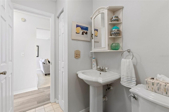 bathroom featuring tile patterned floors and toilet