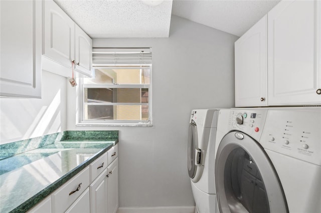 washroom with separate washer and dryer, cabinets, and a textured ceiling