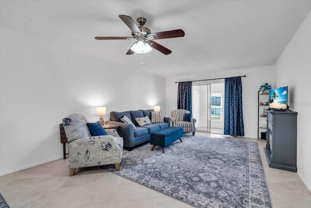 living room featuring ceiling fan and light tile patterned floors