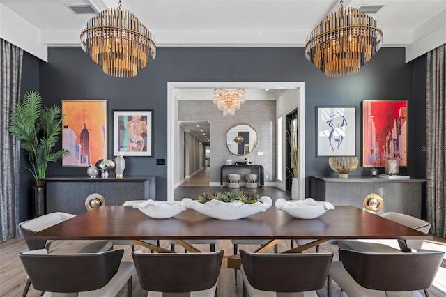 dining space with an inviting chandelier and hardwood / wood-style floors