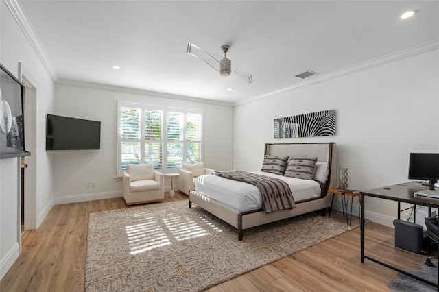 bedroom with ornamental molding and light wood-type flooring