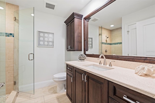 bathroom with vanity, an enclosed shower, tile patterned floors, and toilet