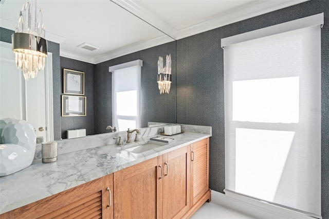 bathroom with vanity, ornamental molding, and toilet