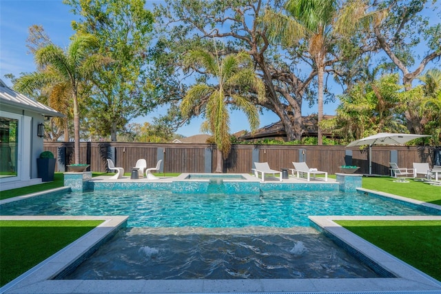 view of swimming pool with a yard