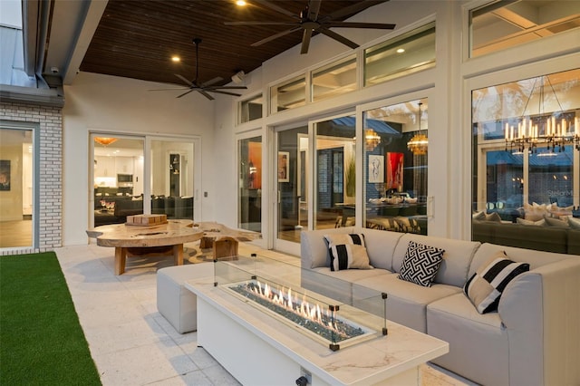 view of patio / terrace featuring an outdoor living space with a fire pit and ceiling fan