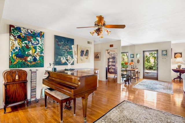 miscellaneous room with light hardwood / wood-style flooring and ceiling fan