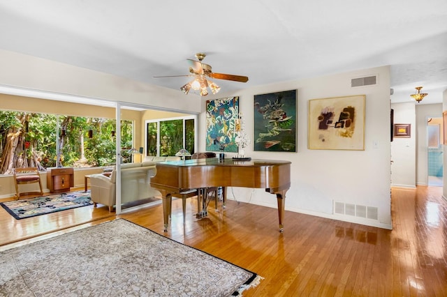 misc room featuring hardwood / wood-style flooring and ceiling fan