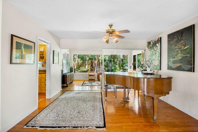 misc room featuring light hardwood / wood-style floors and ceiling fan