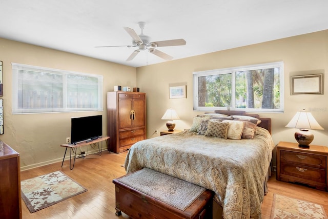 bedroom featuring ceiling fan and light hardwood / wood-style flooring