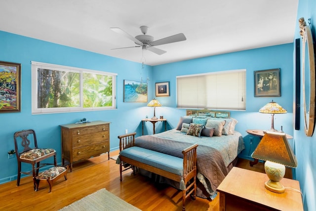 bedroom featuring wood-type flooring and ceiling fan