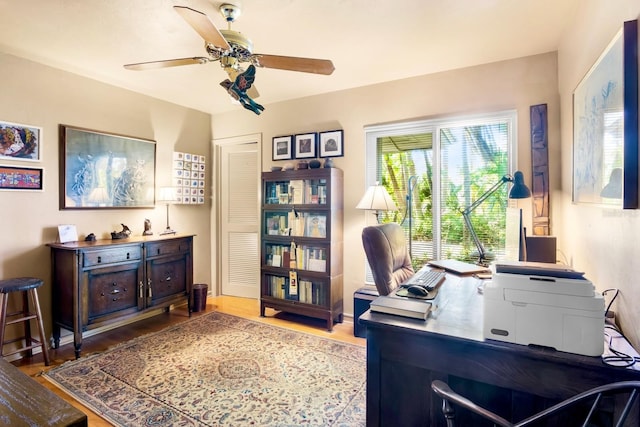 office area with hardwood / wood-style flooring and ceiling fan