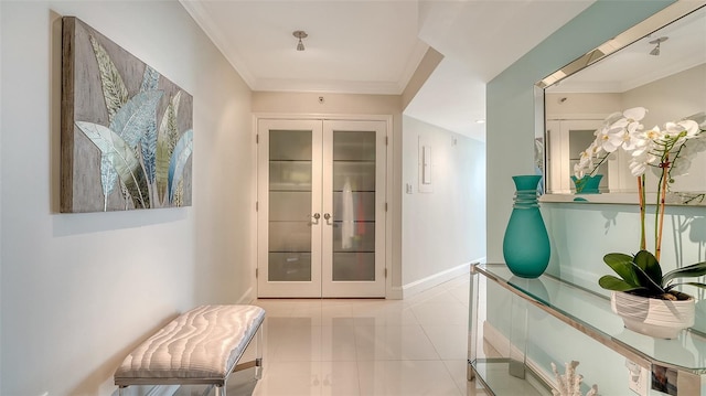 corridor featuring french doors, crown molding, baseboards, and tile patterned floors