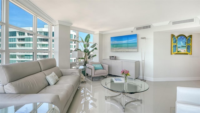 tiled living area featuring visible vents, crown molding, and baseboards