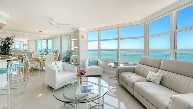 sunroom / solarium with ceiling fan and a water view