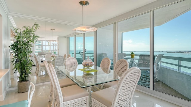 dining room with expansive windows and crown molding