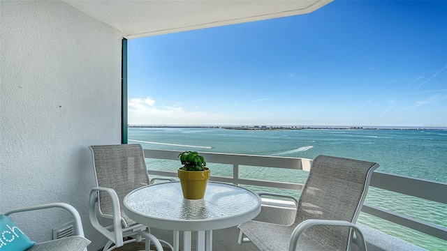 balcony featuring a water view