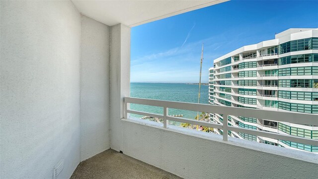 balcony featuring a water view