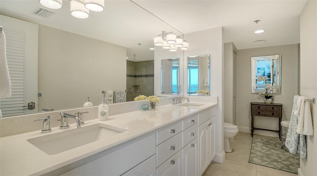 full bath featuring visible vents, a sink, a tile shower, and toilet