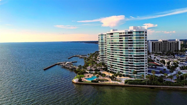 birds eye view of property with a view of city and a water view