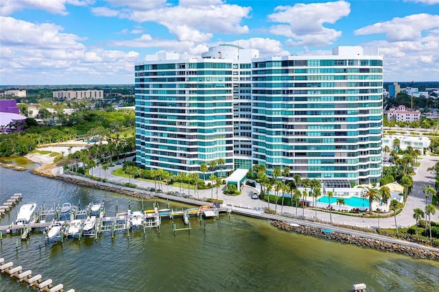 view of property with a water view and a view of city