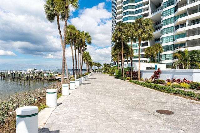 surrounding community featuring a water view