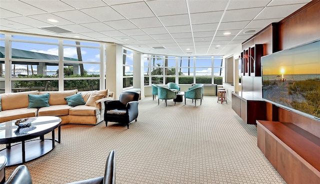 sunroom / solarium with a paneled ceiling