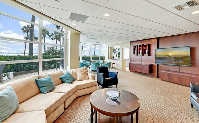 sunroom with a drop ceiling and visible vents