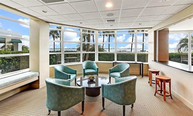 sunroom with visible vents and a drop ceiling