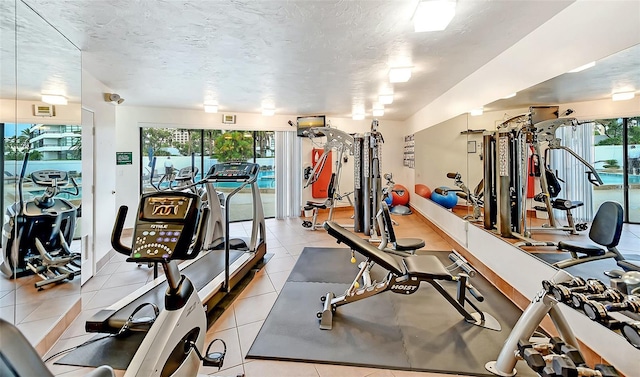 workout area featuring a textured ceiling