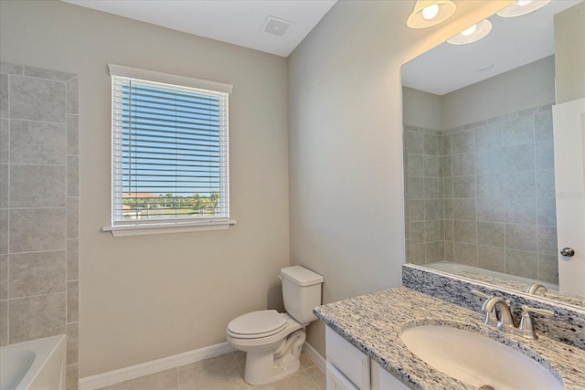 bathroom featuring vanity, tile patterned floors, and toilet