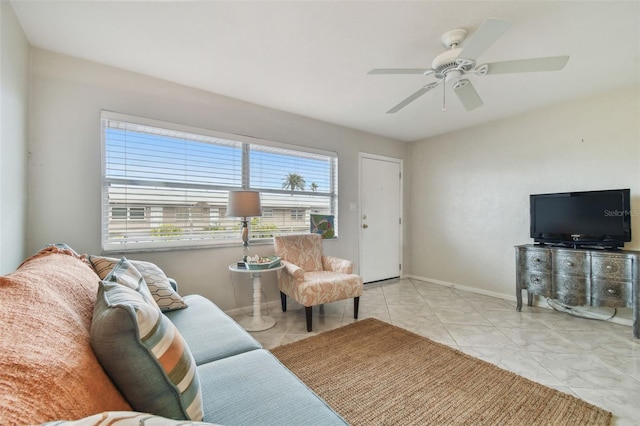 tiled living room with ceiling fan