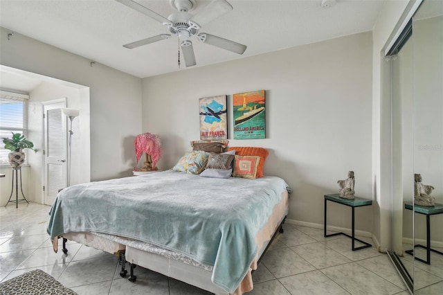 bedroom with light tile patterned floors and ceiling fan