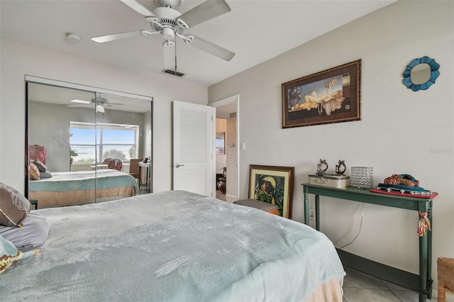 tiled bedroom with ceiling fan