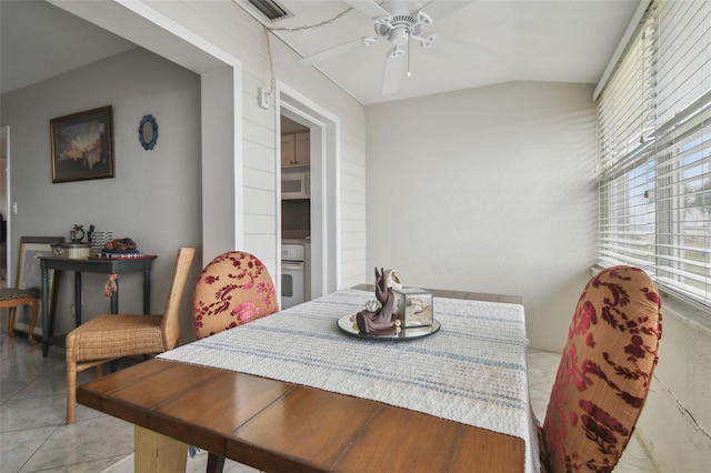 dining room featuring light tile patterned floors and ceiling fan