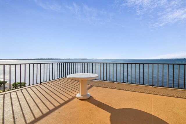 exterior space with a balcony and a water view