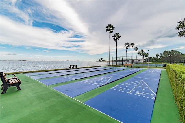 view of home's community featuring a water view and tennis court