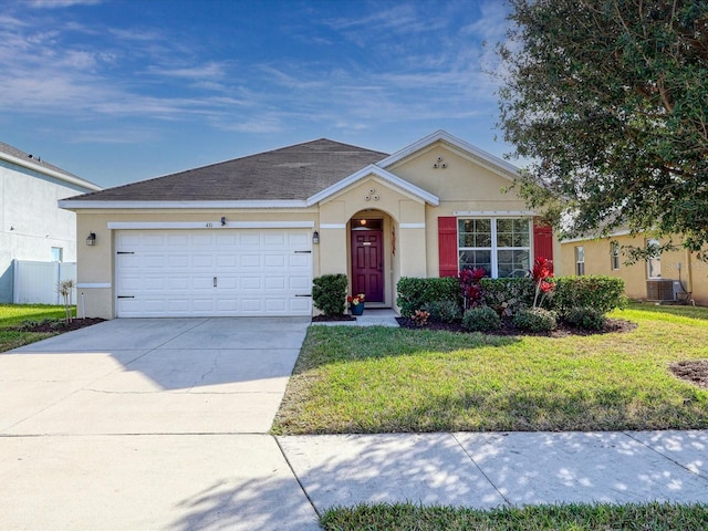 ranch-style house with a garage, a front lawn, and central air condition unit