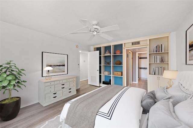 bedroom with ceiling fan and light hardwood / wood-style flooring