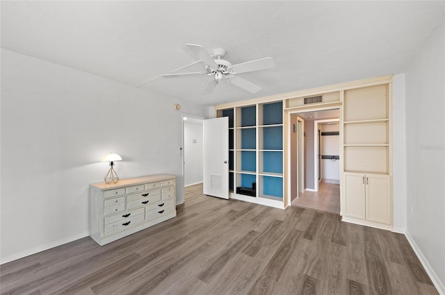 interior space with hardwood / wood-style flooring and ceiling fan