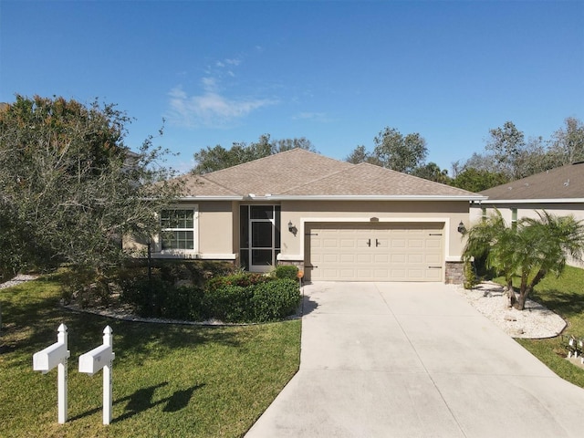 single story home with a garage and a front lawn