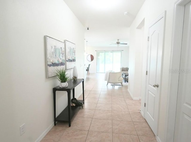 5718 Broad River Run, Ellenton, FL 34222 - corridor with light tile patterned floors and baseboards