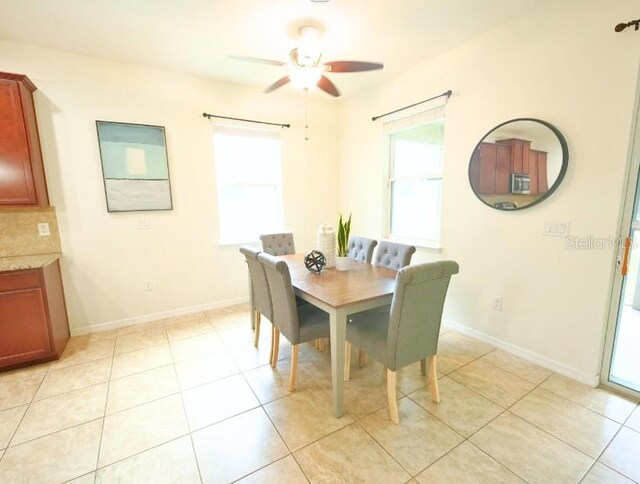 5718 Broad River Run, Ellenton, FL 34222 - dining space featuring a ceiling fan, healthy amount of natural light, and light tile patterned flooring