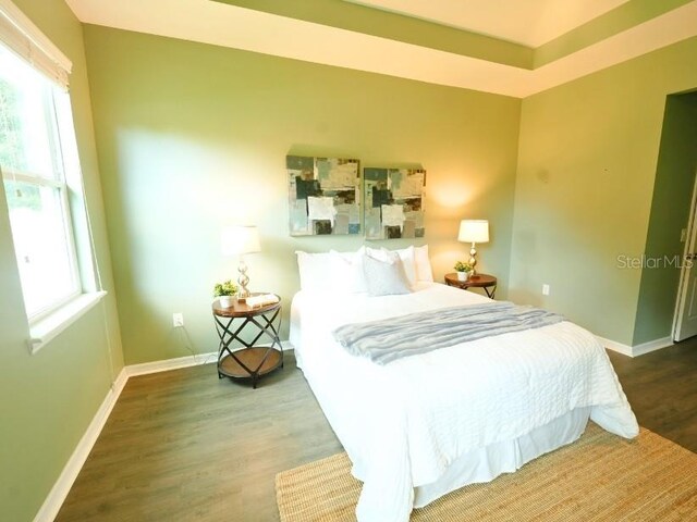 5718 Broad River Run, Ellenton, FL 34222 - bedroom featuring wood finished floors and baseboards
