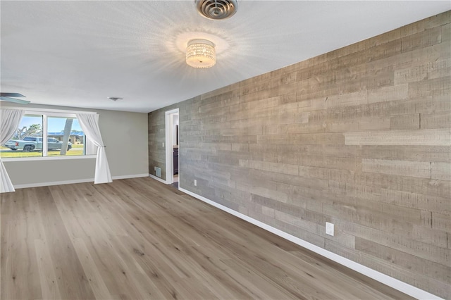 unfurnished room featuring wood-type flooring