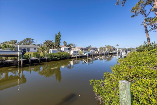 property view of water with a dock