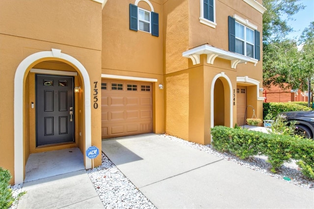 entrance to property featuring a garage