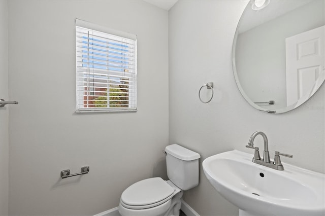 bathroom featuring sink and toilet